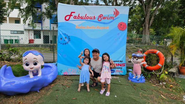 Coach and student posing poolside